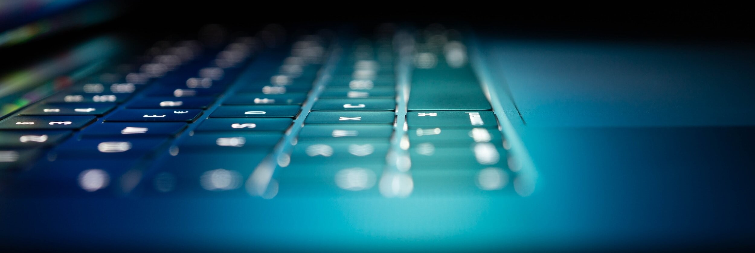 A laptop keyboard. Tetrel's reports are expertly crafted with prescriptive guidance to minimize friction during remediation.